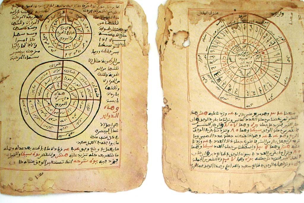 Two pages of Timbuktu manuscripts on astronomy and mathematics, with circular star charts and Arabic script